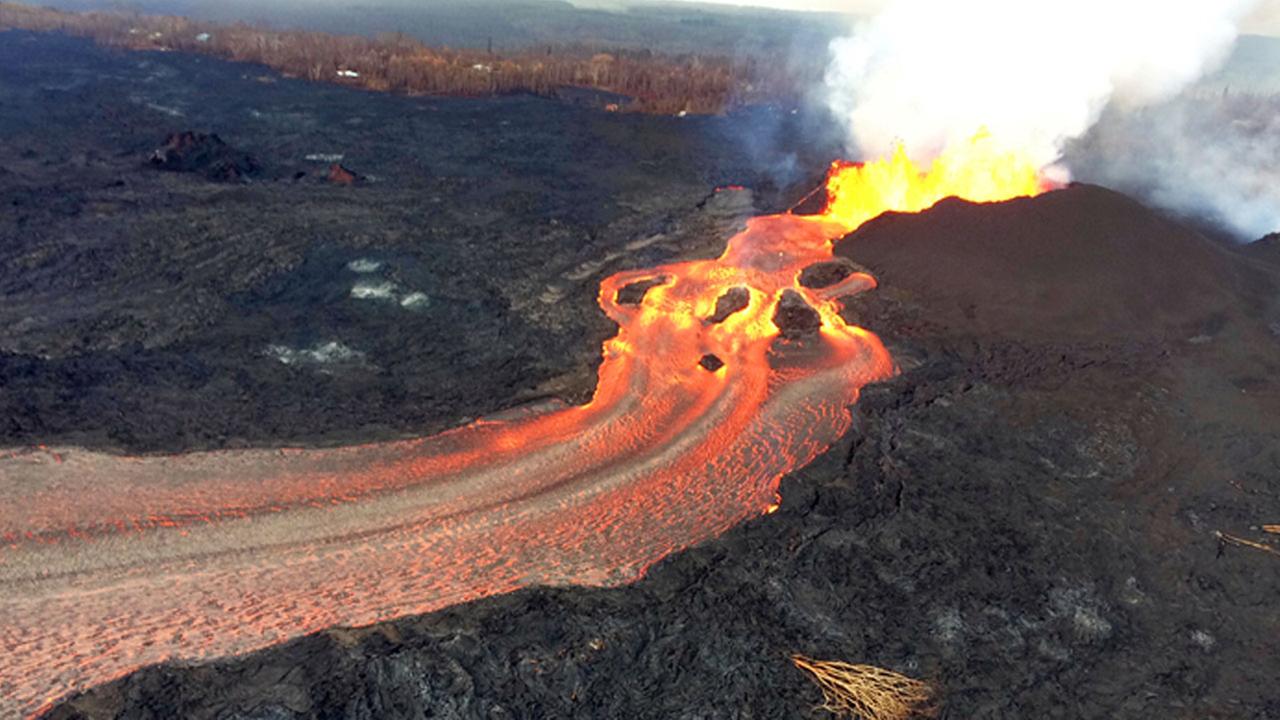 Kilauea volcano turns eerie as lava burns red against darkness of