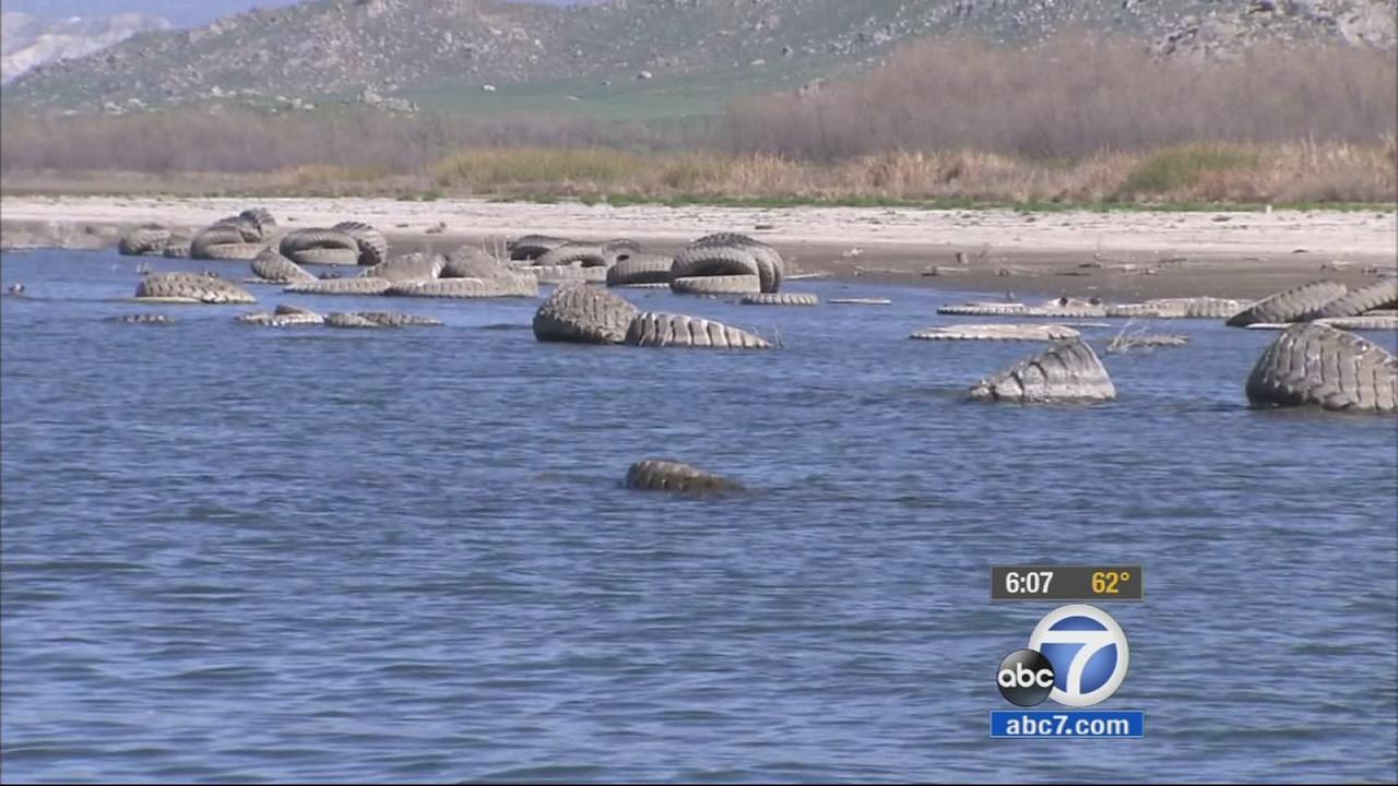Dozens of tires surface at Lake Perris as water level drops amid