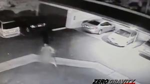Surveillance video shows naked man jumping onto hood of car in ...