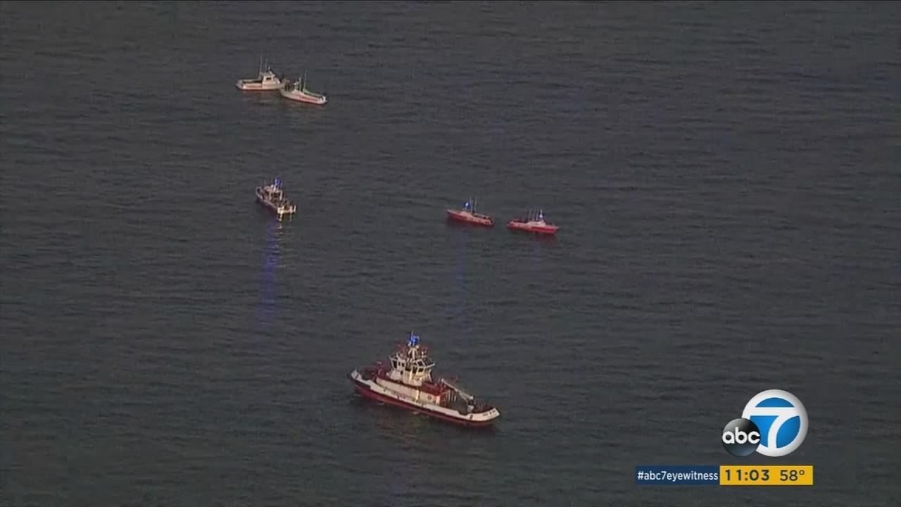 Divers Recover Victims Remains Debris From San Pedro Plane Crash Area