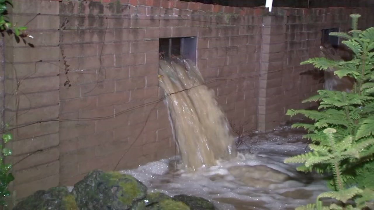 Storm sends water rushing into Saratoga woman's backyard