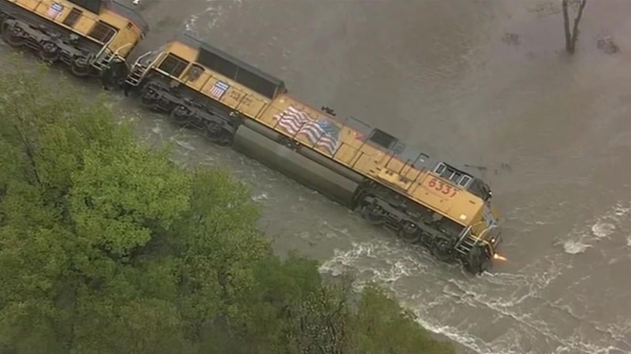 Derailed train submerges in Texas flood waters, 2 rescued