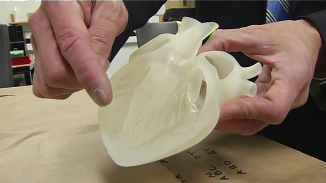 3D printing machines being used to make plastic model