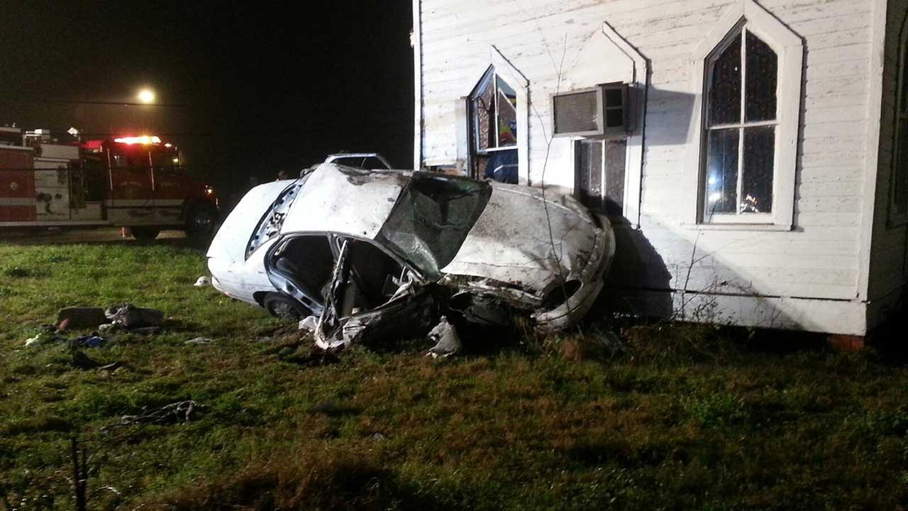 Woman ejected in rollover wreck goes through church window; suffers
