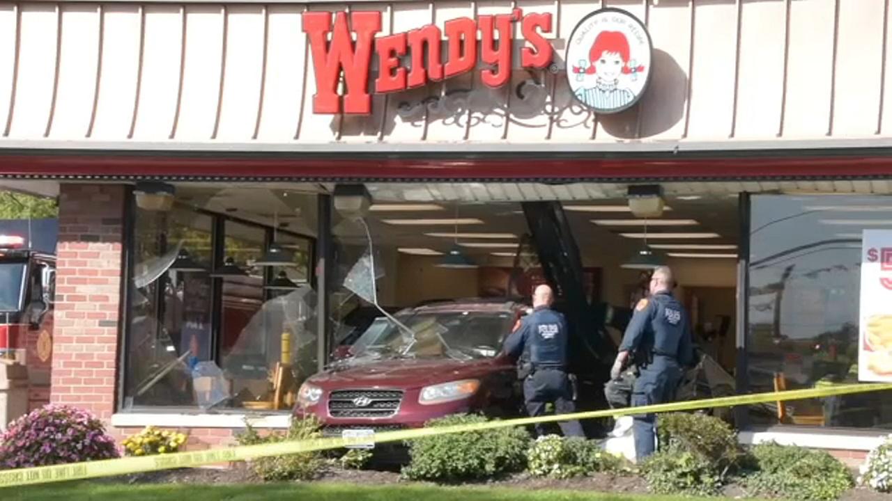 Elderly driver, 7 others taken to hospital when car crashes into Wendy