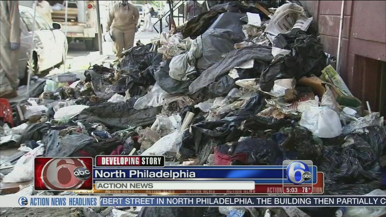 Trash pours from hoarding home in North Philadelphia