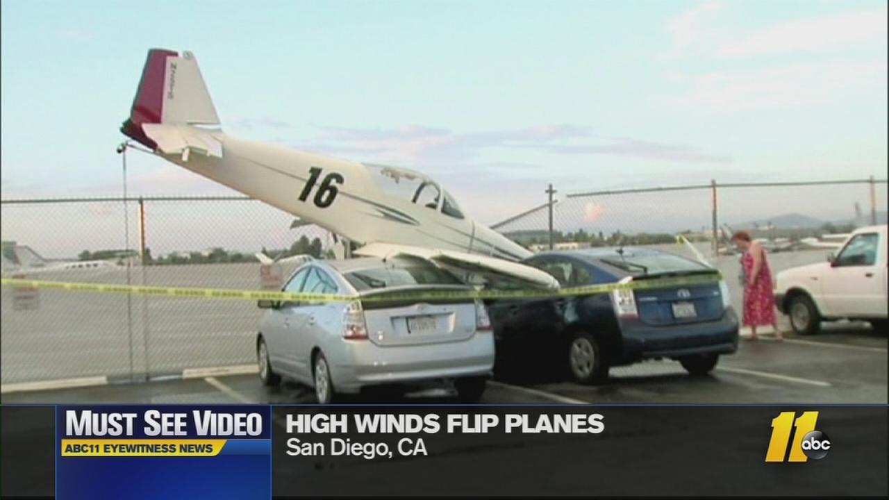 must-see-videos-wind-sends-planes-crashing-into-cars-abc11