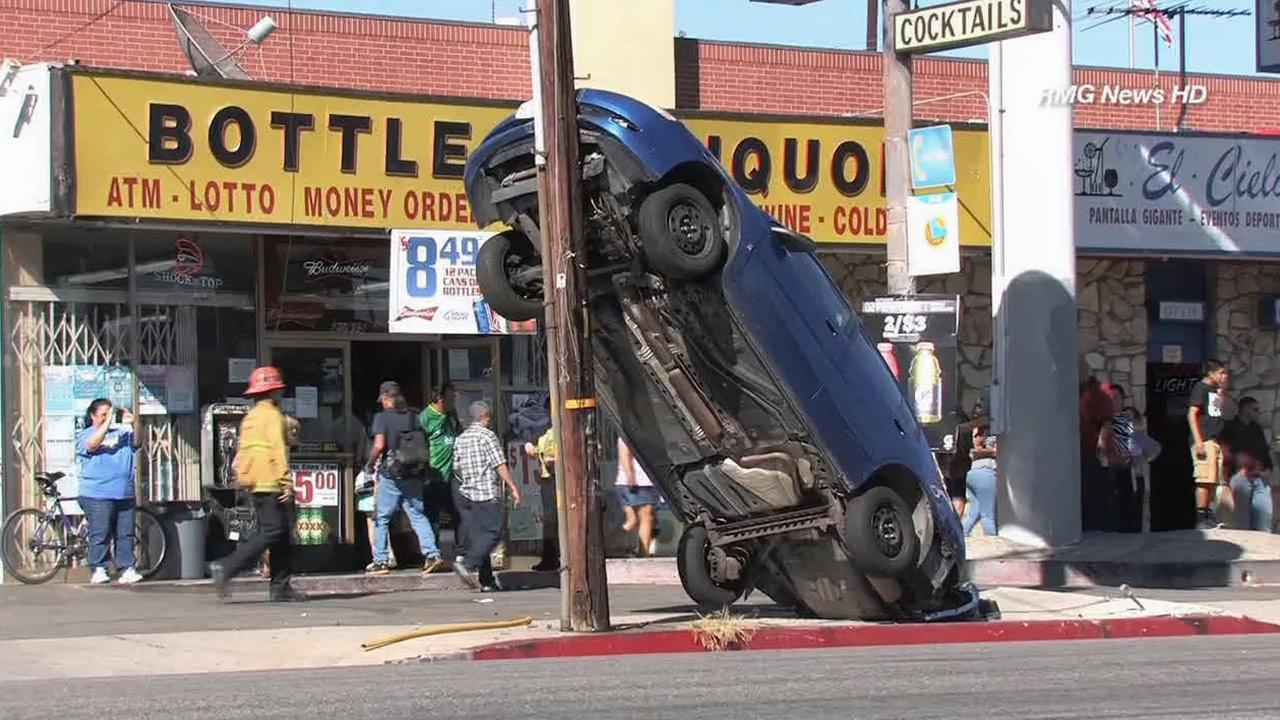 Car lands vertically after Canoga Park crash